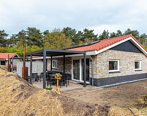 Nesserduinen 42E vakantiehuis in Nes, Ameland met ruime veranda en uitzicht op natuur.