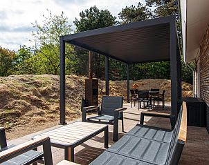 Geniet van het ruime terras bij Nesserduinen 42C in Nes, Ameland. Vakantiehuis met comfortabele buitenruimte in de Waddeneilanden.