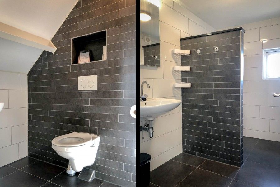 Stilvolles Badezimmer mit dunklen Kacheln in Unique 10 pers. Bauernhof Lodge De Vuurtoren in 'Hoeve Vianen', Ferienhaus in De Cocksdorp, Texel.