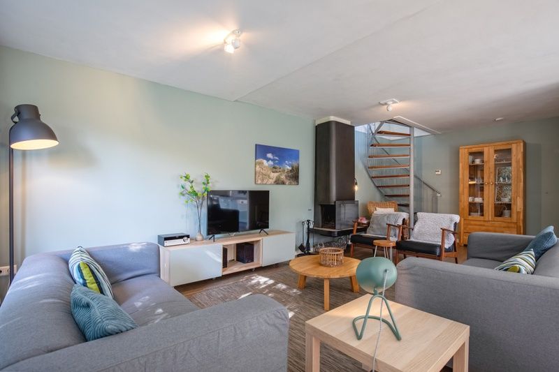 Gezellige woonkamer in Villapark Residentie Texel nr. 794, vakantiehuis in De Cocksdorp, Texel, met comfortabele zithoek en moderne inrichting.