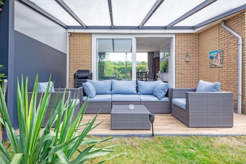 Covered terrace of Bungalow Duin aan Zee Texel, Bungalowpark Tamarisk, De Cocksdorp for ultimate relaxation.