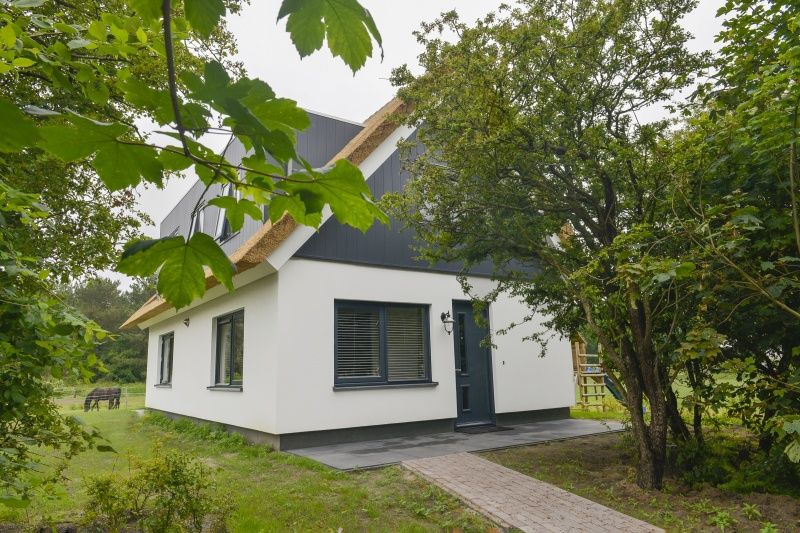 Vooraanzicht van De Postschipper vakantiewoning in De Cocksdorp, Texel, met charmante entree.