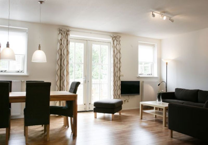 Lichte woonkamer van Type 8 - 2108 vakantiehuis in De Cocksdorp, Texel, met moderne inrichting.