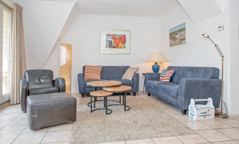 Comfortabele woonkamer in Vakantiehuis Slufterduin 076, De Cocksdorp. Ideaal voor ontspanning op Texel, Waddeneilanden.