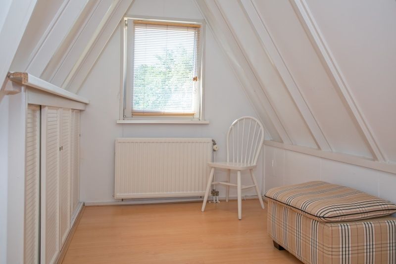 Rustige zolderruimte in Vakantiehuis Slufterduin 076, De Cocksdorp. Perfect voor ontspanning op Texel, Waddeneilanden.