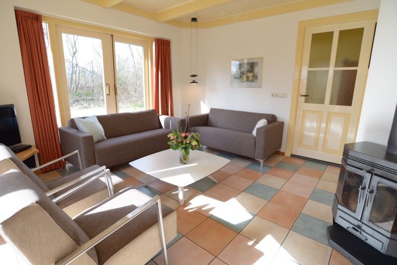 Gezellige woonkamer van De Velduil vakantiehuis in De Cocksdorp, Texel.