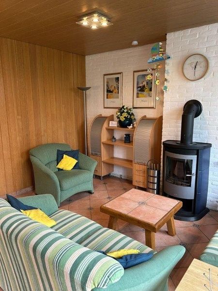 Comfortabele zithoek in Vakantiehuis Slufterhoek 128, De Cocksdorp, Texel met warme inrichting.