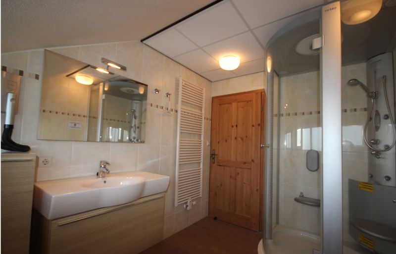 Bathroom with shower cabin in Villa De Witte Hoek conservatory, De Cocksdorp, Texel.