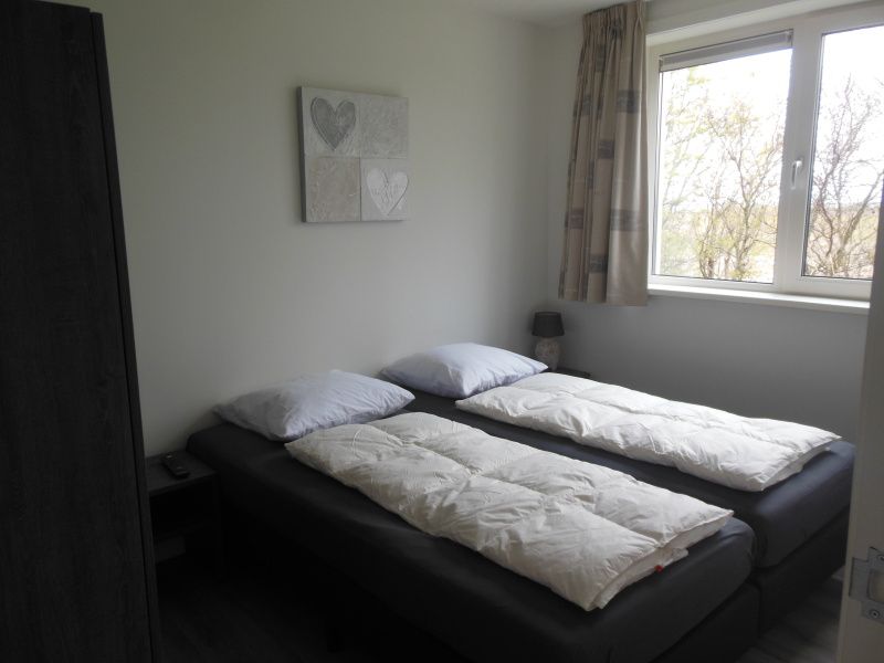 Comfortabele slaapkamer in Zevenbergen Texel - Bungalow Zevenbergen, De Cocksdorp, met uitzicht op de natuur.