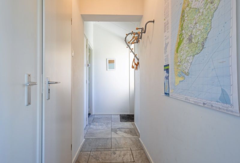 Eingang mit Karte von Texel bei Holiday home Slufterhoek 078, De Cocksdorp.