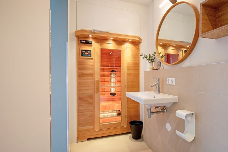 Wellness area with sauna in Holiday home De Razende Bol, De Cocksdorp, Texel, for ultimate relaxation.