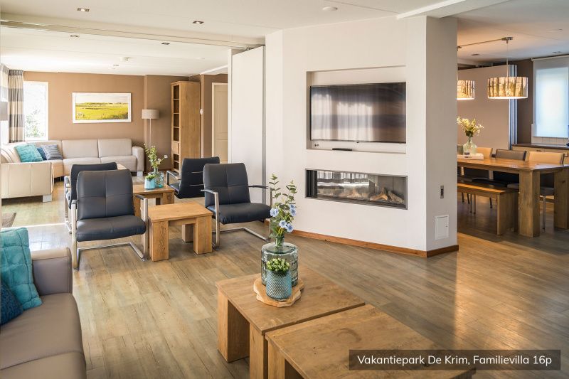 Spacious living room in Family Villa 16 persons, De Cocksdorp, Texel with modern furnishings.