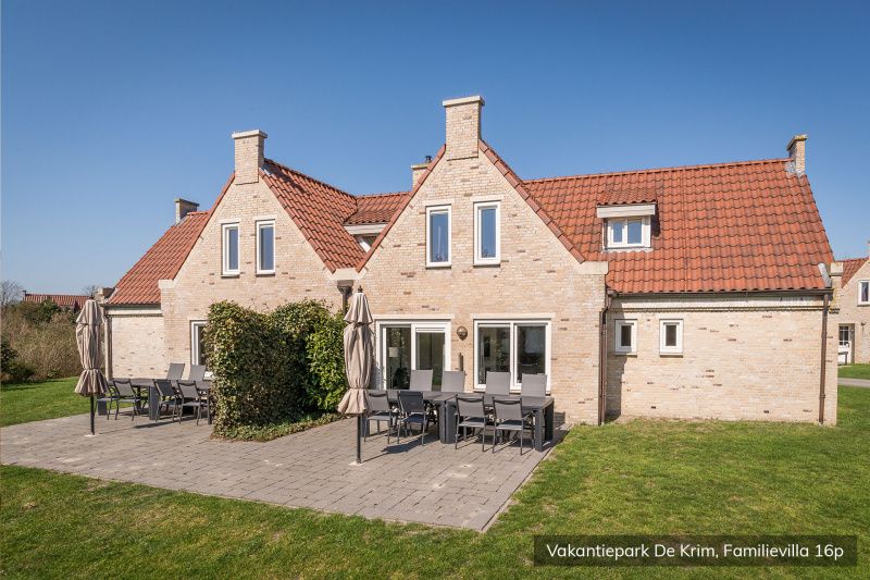 Sunny terrace at Family villa 16 persons, De Cocksdorp, Texel with garden furniture.