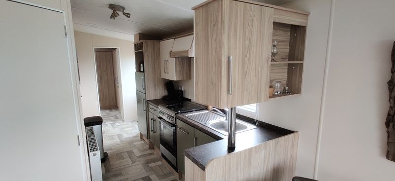 Modern kitchen in Chalet Duunzicht, a vacation home in De Cocksdorp, Texel, with stylish wooden finishes and complete amenities.