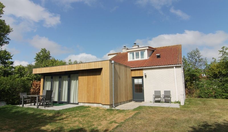 Vacation home D 449 in De Cocksdorp, Texel, offers a modern outdoor space with terrace and green surroundings on the Wadden Islands.