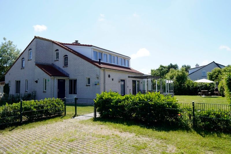 Vacation home D 669 in De Cocksdorp, Texel offers a spacious terrace and green surroundings for a relaxing stay on the Wadden Islands.