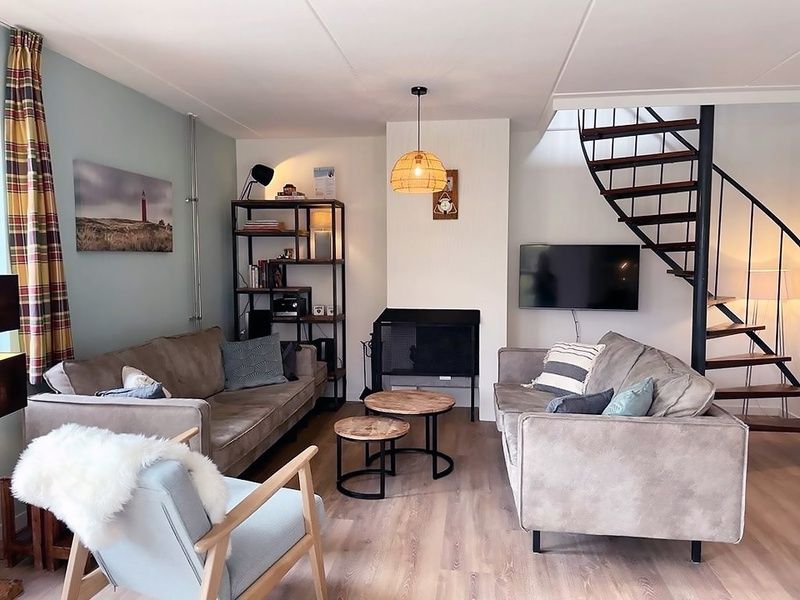 Gezellige woonkamer van Vakantiehuis D 709 in De Cocksdorp, Texel. Comfortabele zitruimte met moderne inrichting op de Waddeneilanden.