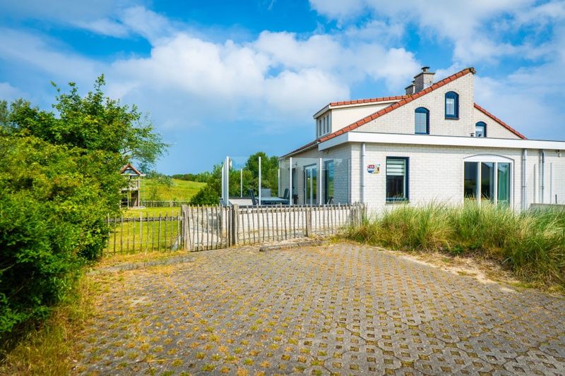 Vakantiehuis D 473 in De Cocksdorp, Texel, met zonnig terras en omringd door natuur op de Waddeneilanden.