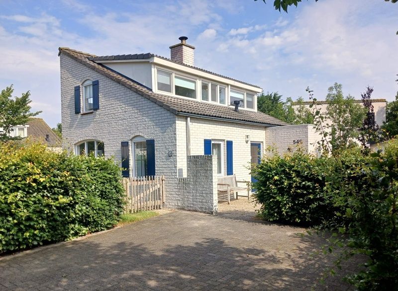 Vacation home F 549 in De Cocksdorp, Texel, offers a charming exterior with spacious garden and terrace, ideal for a relaxing stay on the Wadden Islands.