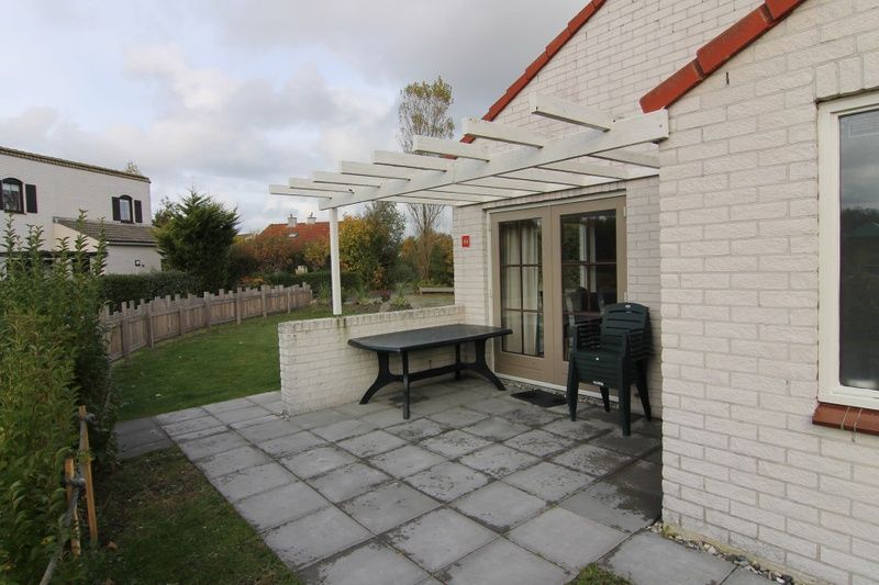 Geniet van het terras bij Vakantiehuis D 441 in De Cocksdorp, Texel, ideaal voor ontspanning op de Waddeneilanden.