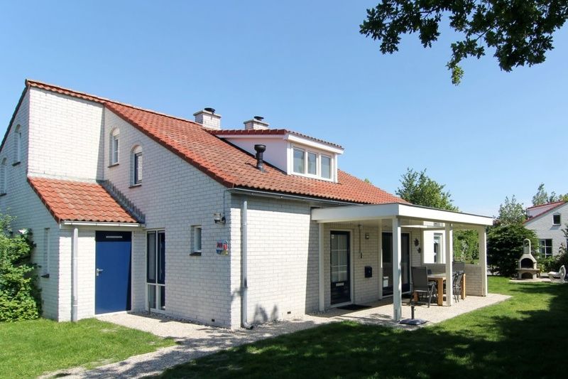Ferienhaus D 707 in De Cocksdorp, Texel, mit sonniger Terrasse und gruenem Garten, ideal fuer einen entspannten Aufenthalt auf den Watteninseln.