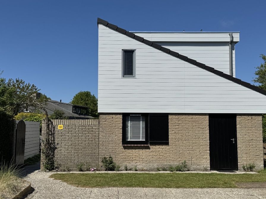 Vacation home A 301 in De Cocksdorp, Texel offers a charming exterior with modern architecture on the Wadden Islands.