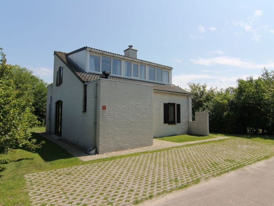 Vakantiehuis E 571 in De Cocksdorp, Texel, een charmant vakantiehuis omringd door groene natuur op de Waddeneilanden.