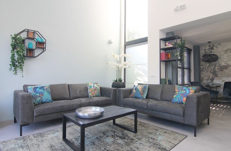 Modern living room in Holiday home E 525, De Cocksdorp, Texel. Comfortable sitting area with colorful cushions in a stylish vacation home.