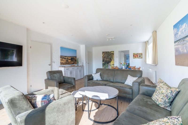 Cozy sitting area in Orchismient 14 vacation home, De Koog Texel with modern furnishings.