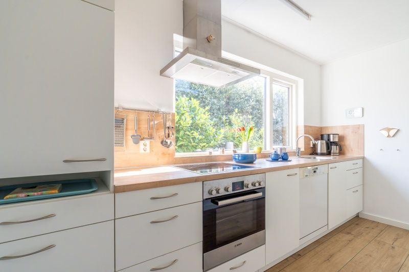 Functional kitchen in Orchismient 14 vacation home, De Koog Texel overlooking nature.