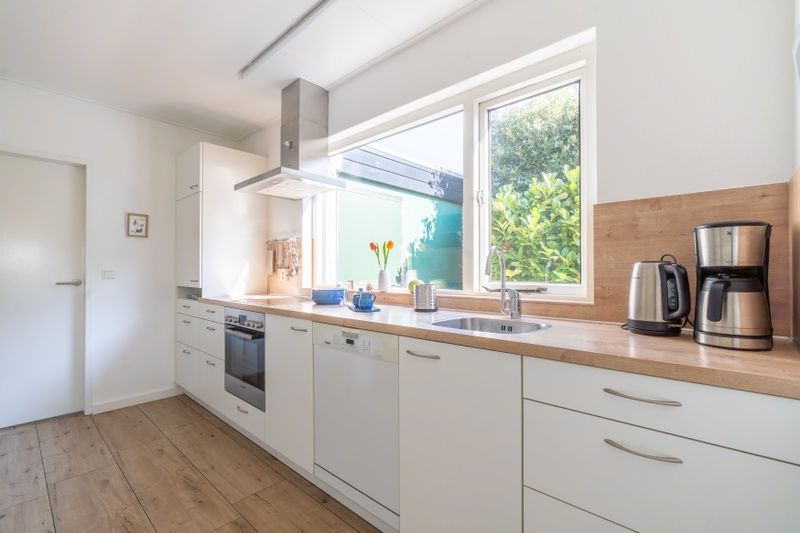 Bicycle storage in Orchismient 14 vacation home, De Koog Texel with charging point for e-bikes.