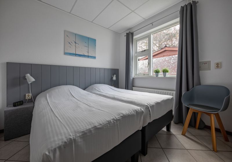 Slaapkamer in Riddertje vakantiehuis, De Koog, Texel. Rust en comfort op de Waddeneilanden.