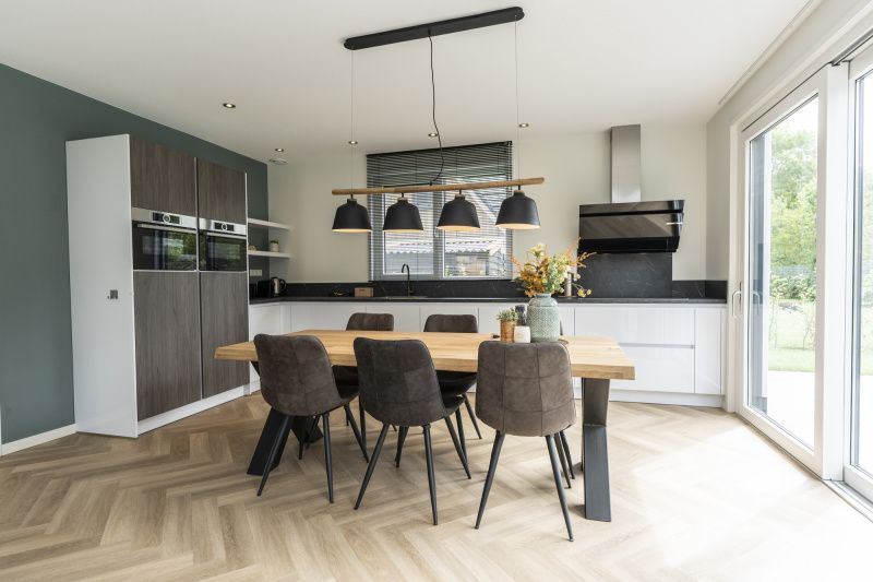 Modern kitchen in Villa 39 vacation home De Koog Texel with spacious dining table.