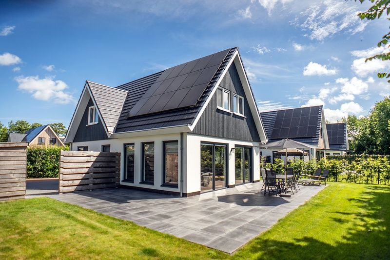 Villa 39 in De Koog Texel with large terrace and green surroundings.