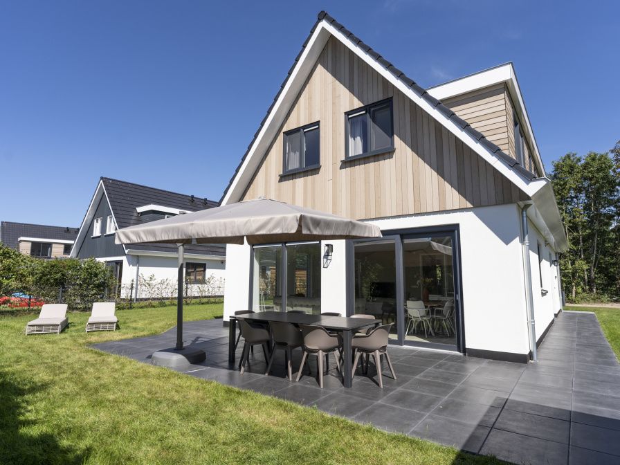 Villa 19 in De Koog on Texel, a vacation home with sunny terrace and modern outdoor space.