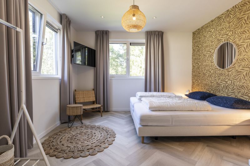 Attractive bedroom in Villa 19, De Koog, Texel, with luxurious bed and soothing ambiance.