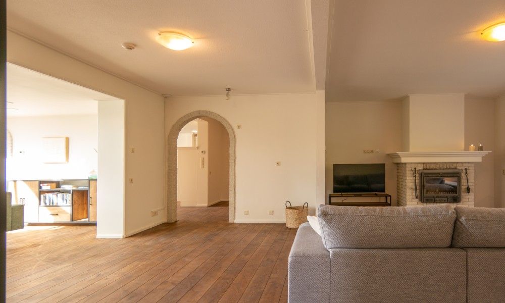 Cozy indoor area with fireplace in Kamerstraat 66 vacation home in De Koog Texel for cozy evenings.