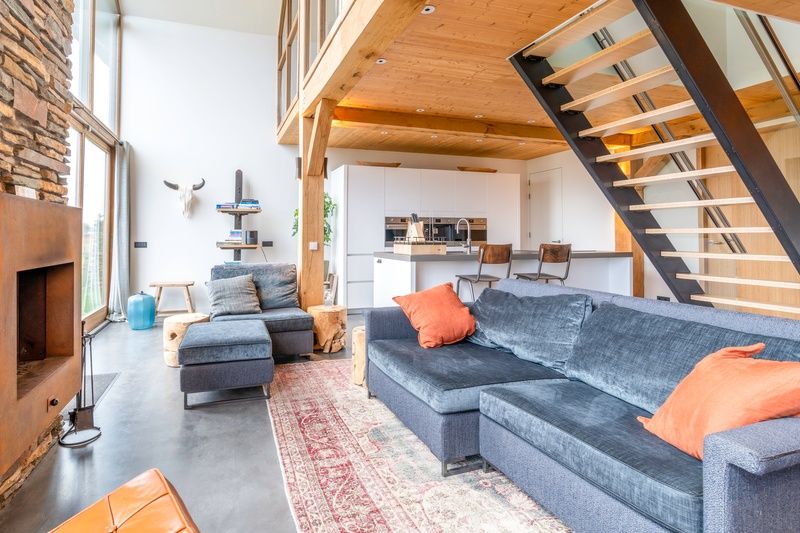 Modern kitchen and comfortable sitting area in Villa 191 with Hottub, De Koog, Texel, perfect for relaxation.