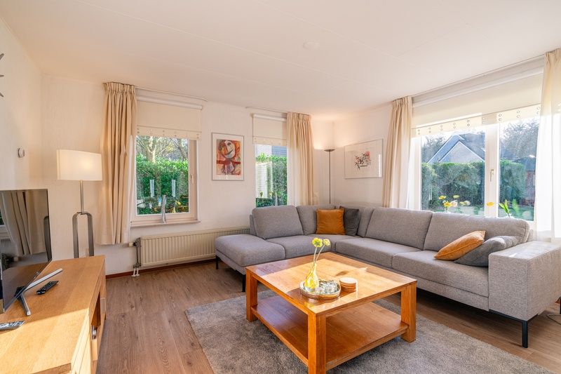 Cozy living room of Holiday home Honeysuckle 61 in De Koog, Texel, Wadden Islands.