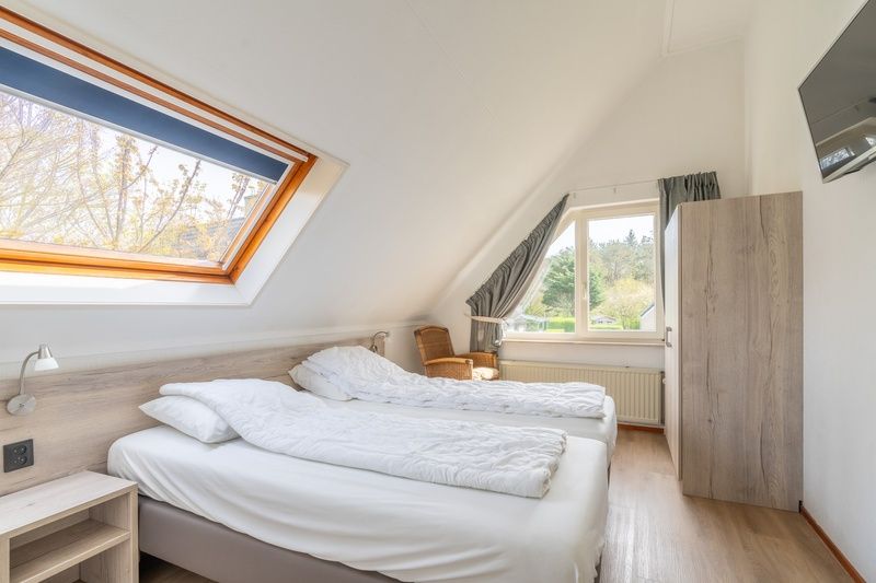 Bedroom with skylight in Holiday home Honeysuckle 61, De Koog, Texel, Wadden Islands.