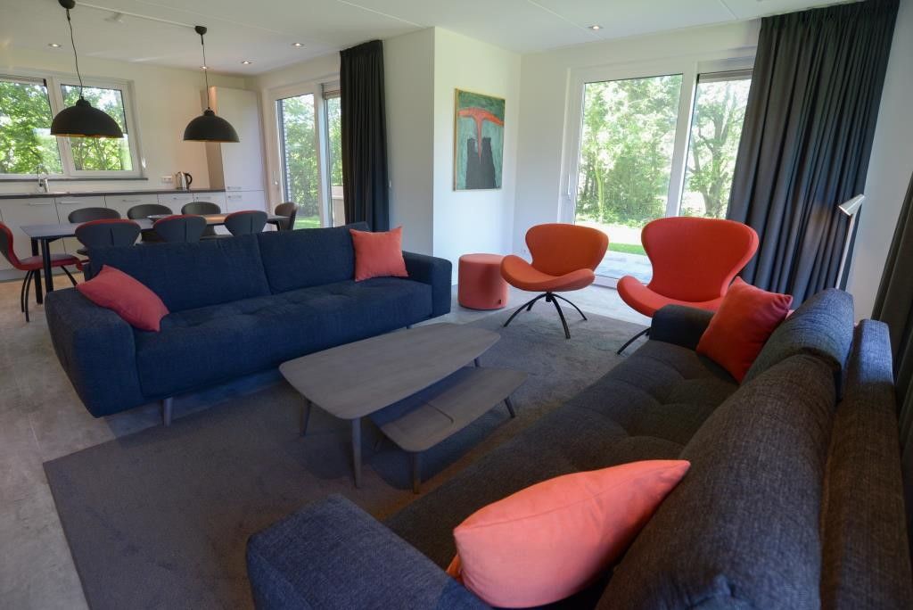 Comfortable sitting area in 06 - Razende Bol - allotment vacation home in De Koog, Texel with garden view.