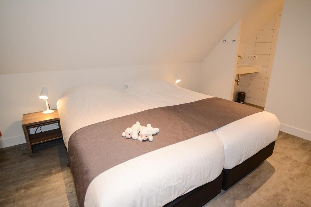 Cozy bedroom in 06 - Razende Bol - allotment vacation home in De Koog, Texel with double bed.