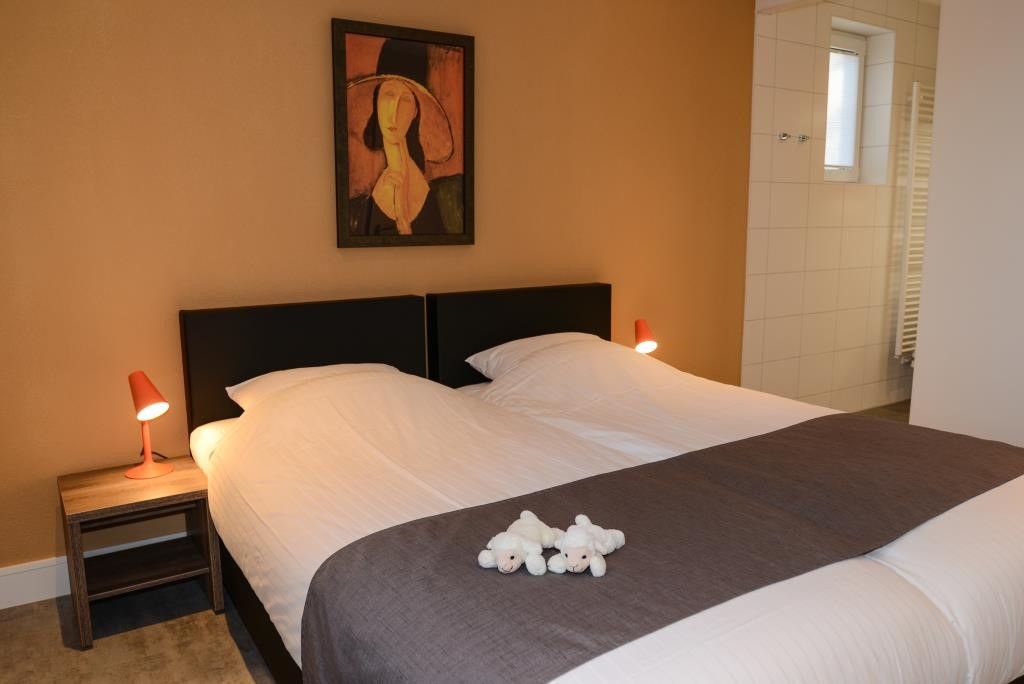 Bedroom with artwork in 06 - Razende Bol - allotment vacation home in De Koog, Texel.