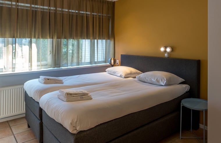 Comfortabele slaapkamer in vakantiehuisje in De Koog, Texel, Waddeneilanden.