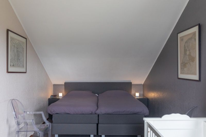 Knusse slaapkamer in Stappeland - De Groene Boei, vakantiehuis in De Koog, Texel, met comfortabel tweepersoonsbed.