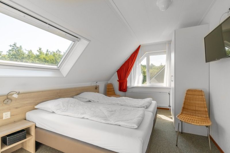 Sfeervolle slaapkamer in Vakantiehuis Kamperfoelie 77, De Koog, Texel