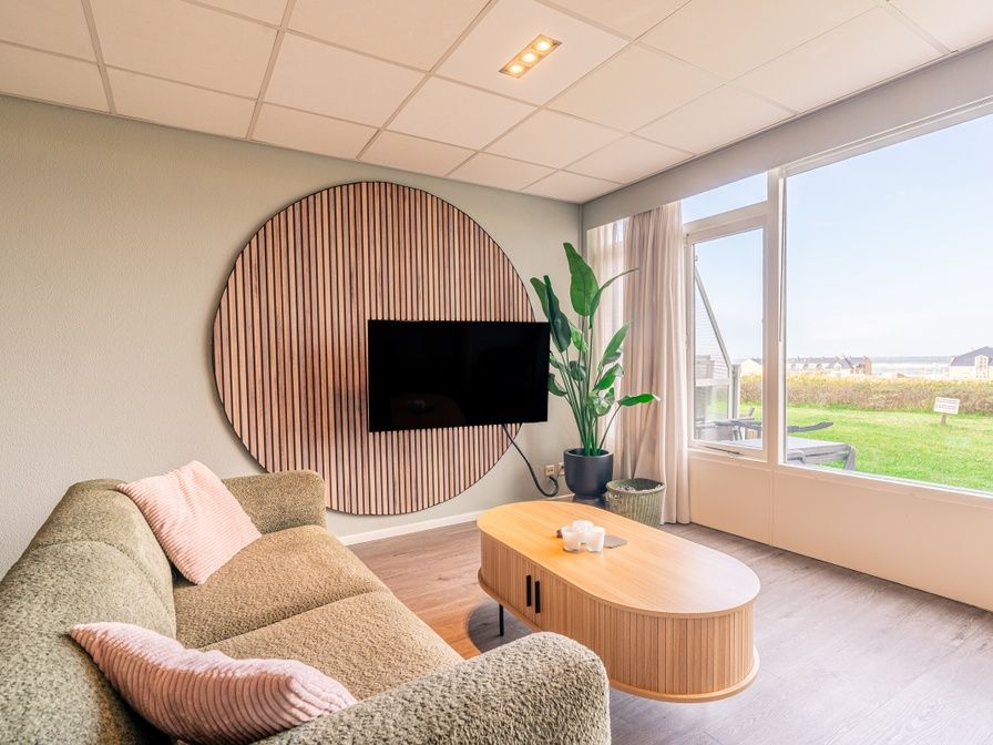 Gemuetliches Wohnzimmer im Appartement Juliana 028 Zeezicht, De Koog, Texel mit schoenem Meerblick.