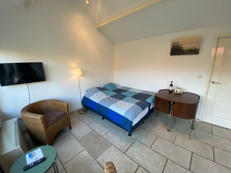 Slaapkamer van Studio Ooster - Brink 28, De Koog, Texel, comfortabel vakantiehuis op de Waddeneilanden.