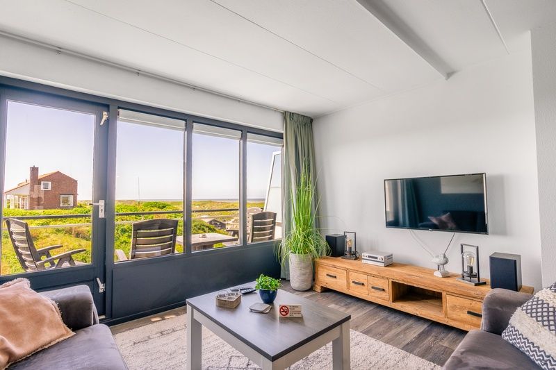 Bright living room in Apartment Juliana 094 Island and Sea View, De Koog, Texel with terrace and beautiful sea view.