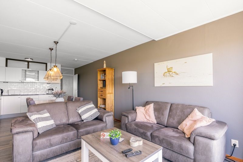 Spacious living room with open kitchen in Apartment Juliana 094 Island and Sea View, De Koog, Texel.